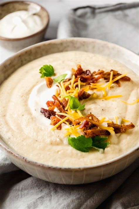Photo of a creamy keto cauliflower soup with crispy bacon