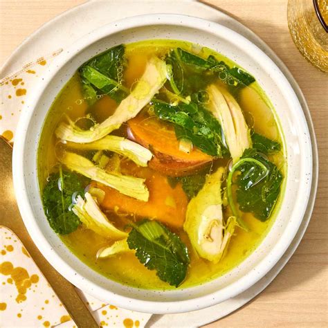 Photo of chicken soup with chickpeas and kale, with a hint of turmeric