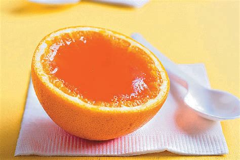 Thematic photo of orange jelly or a bowl of fresh oranges and jelly