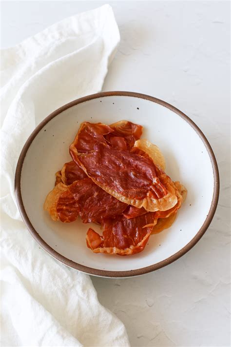 Close-up photo of crispy baked prosciutto slices.