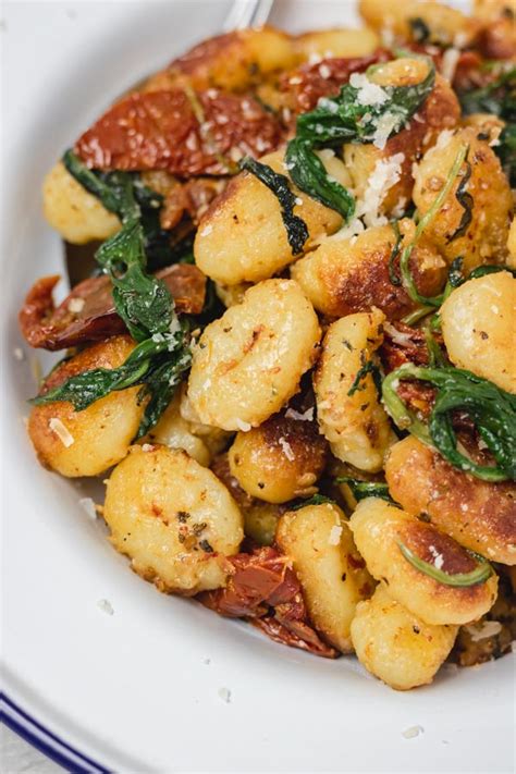 Photo of gnocchi being fried in a pan until golden brown
