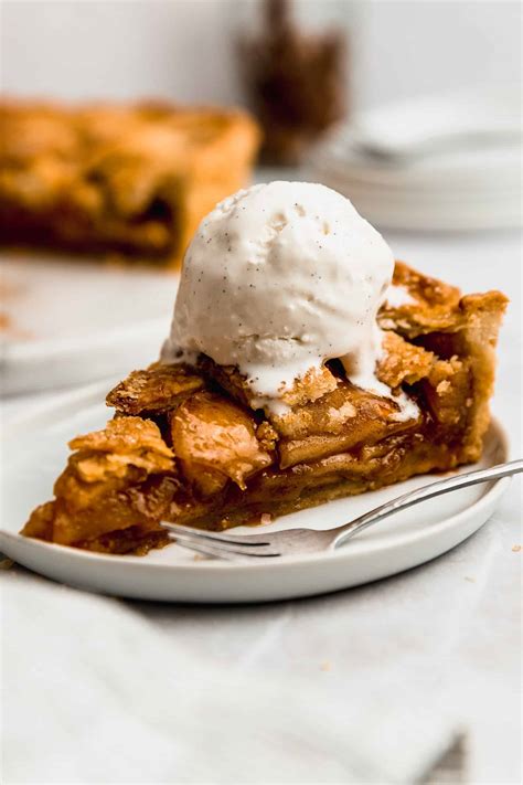 Thematic photo of a slice of apple pie with a scoop of vanilla ice cream