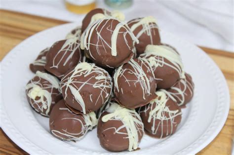 Thematic photo of no-bake chocolate balls with mascarpone, decorated with white chocolate drizzle and sprinkles