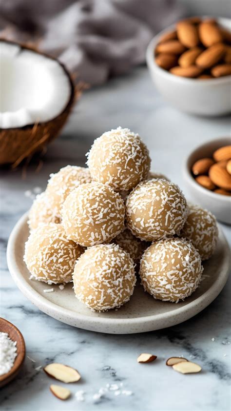 Thematic photo of Raffaello-style coconut balls, perhaps with an almond or hazelnut inside