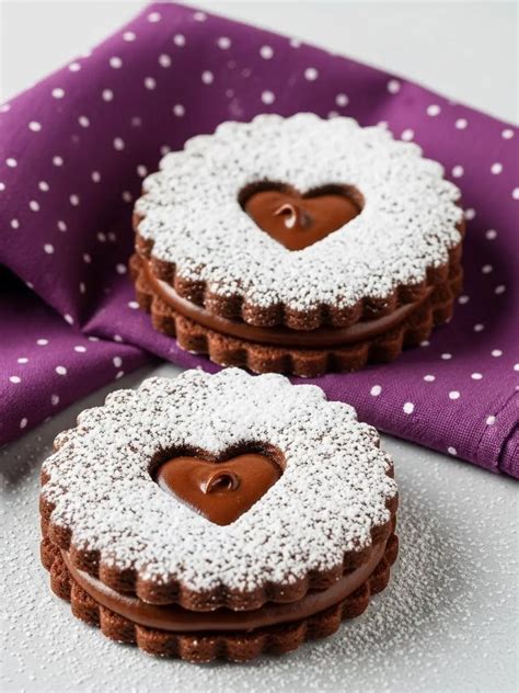 Thematic photo of chocolate Linzer cookies arranged on a festive plate