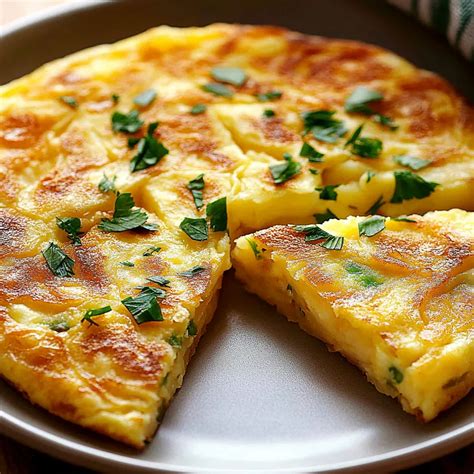The image should show a classic, thick Spanish potato tortilla, freshly made, perhaps sliced.
