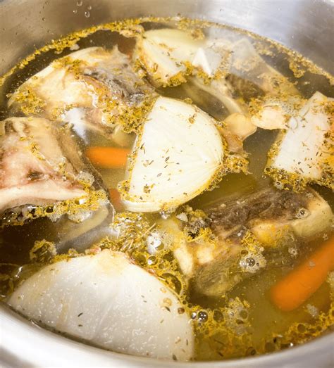 Thematic photo of chicken necks in a culinary context, e.g., in a pot for broth or on a cutting board