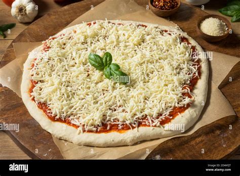 Photo of an unappetizing pizza with uncooked dough