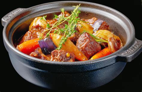 Photo of a hearty stew with meat and vegetables, ready to serve