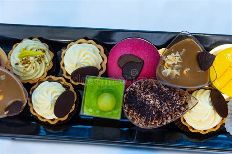 Selection of colorful finger food pastries and mini desserts